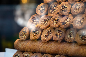 Traditional delicious turkish desserts in the shop window showcase. Different kinds of turkish delights. Popular souvenirs and snacks from Turkey.