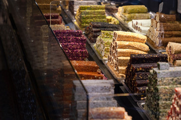 Traditional delicious turkish desserts in the shop window showcase. Different kinds of turkish delights. Popular souvenirs and snacks from Turkey.