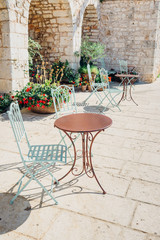 Iron decorated tables and chairs outdoors