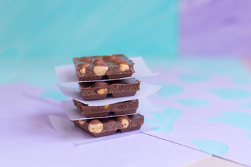Milk chocolate bars on a pastel background