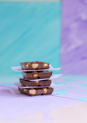 Milk chocolate bars on a pastel background