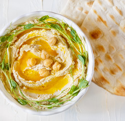 Hummus with olive oil and sprouts - 288178011