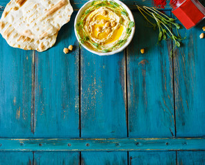 Hummus with olive oil and sprouts