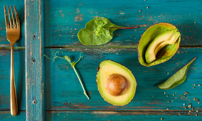 Ripe avocado on a wooden background - 288178296