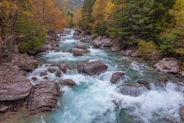 waterfall in autumn. Pyrenees 