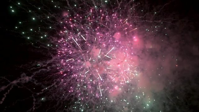 awesome multi-colored launch of multi-colored fireworks in the night sky
