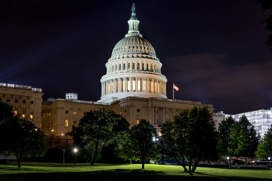 The Capitol at Night - A night  view of  west-side exterior of the U.S. Capitol Building. Washington, D.C., USA. It's a public building. No recognizable trademark, logo or person in the image.