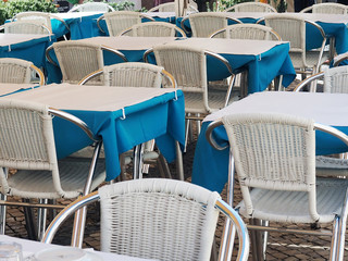 white tables with blue tablecloths