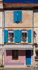 Arles. Facades of old houses and windows with shutters.