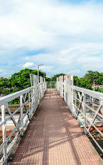 Obraz premium Railway foot over bridge or simply called an Over bridge on a railway station platform almost complete for passengers to pass over a railway station platform. South astern Railway, Kolkata, India