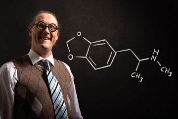 Professor presenting handdrawn chemical formula of MDMA ecstasy