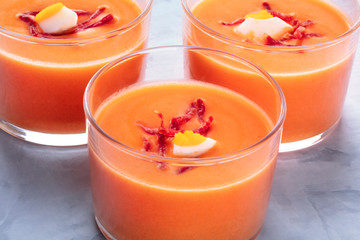 Salmorejo, Spanish cold tomato and bread soup, served in glasses, close-up shot