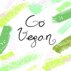 Obraz premium Go vegan. Inspirational quote for posters and cards. Handwritten calligraphy. trendy text on watercolor background for apparel and print design