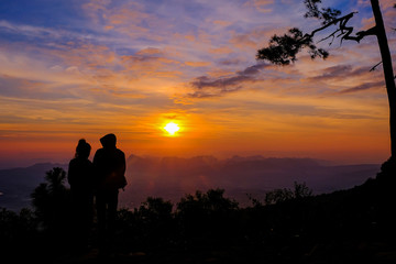 Fototapeta na wymiar Black silhouette Phu Kradueng National Park at sunrise in Loei,Thailand