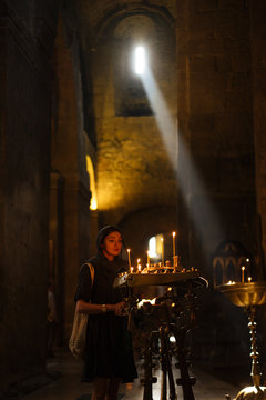 Young woman praying in church