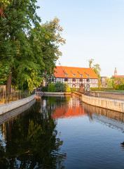 Obraz premium Bydgoszcz. Lock on the Brda River and historic architecture of the city's waterfront