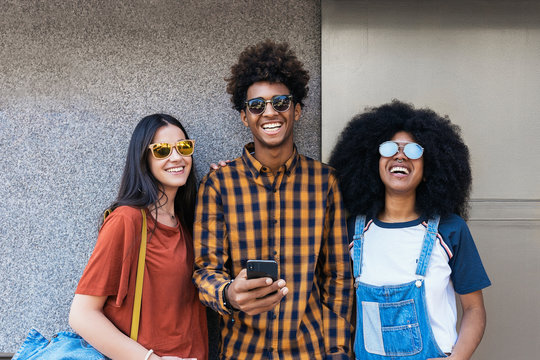 Portrait of group of happy friends looking at camera