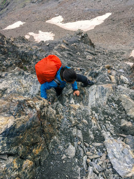 Female hiker climbing a mountain