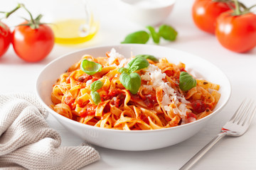 tagliatelle pasta with tomato sauce parmesan basil