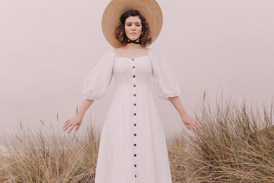 Girl in white dress and hat