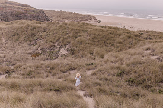 Girl in white dress and hat