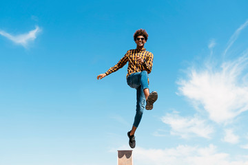 Handsome afro american man jumping