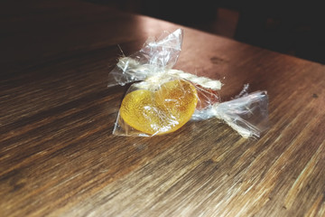 heart-shaped caramel candy on a wooden table