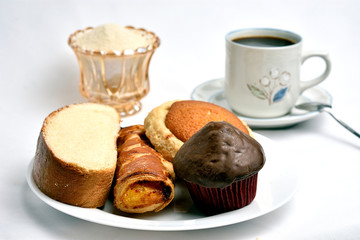Traditional sweet bread, made with handcrafted veracruzanas, the name of the bread is chocolate pancake, pancha eye, pineapple puff pastry, butter slice, in the background a warm coffee with sugar