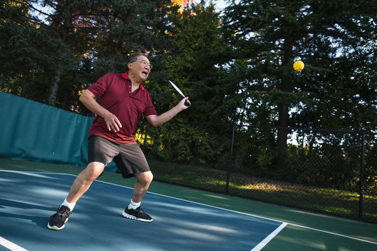 Pickleball man outside.