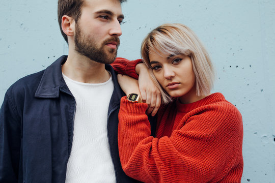 Couple enjoying a moment together against the blue background