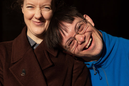 Adoptive siblings share laughter.