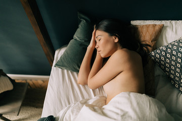 Asian Woman Sleeping On The Bed