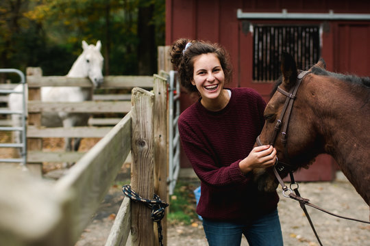 teen getting her horse ready for riding