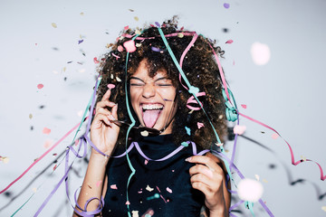 Mixed race woman celebrating a party