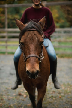teen riding her horse