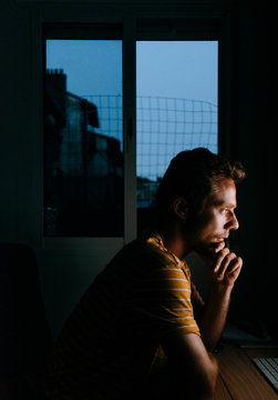 handsome man working at night in front of his computer