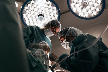 Team of Surgeons Operating in the Hospital