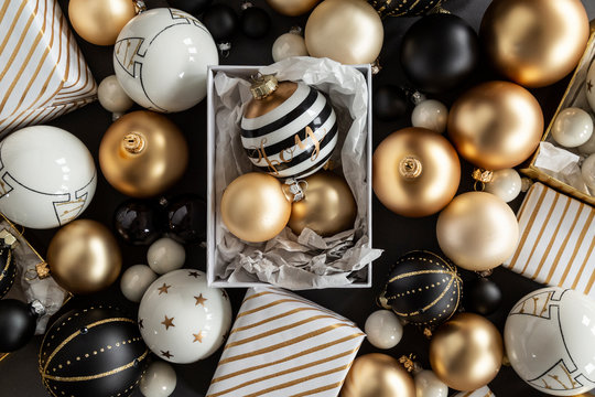 Wrapped Christmas Presents and ornaments, colors black, white and gold