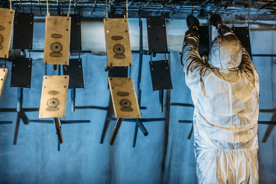 Worker painter at industrial factory