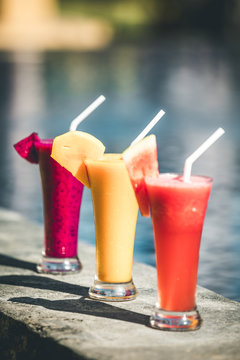 fresh colorful fruit juices in a row