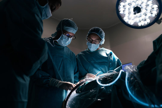 Team of Surgeons Operating in the Hospital