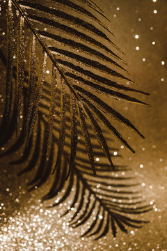 Golden palm tree on a shinning golden background