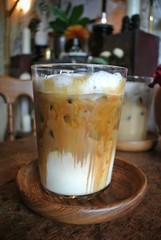Iced coffee on a wooden table in a vintage style cafe