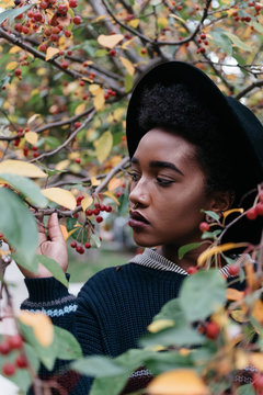 A beautiful young african american woman outside on an autumn day