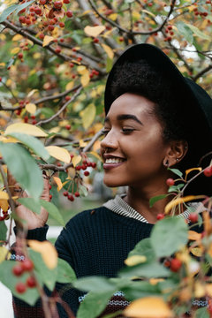 A beautiful young african american woman outside on an autumn day