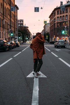 Woman hiding face on road