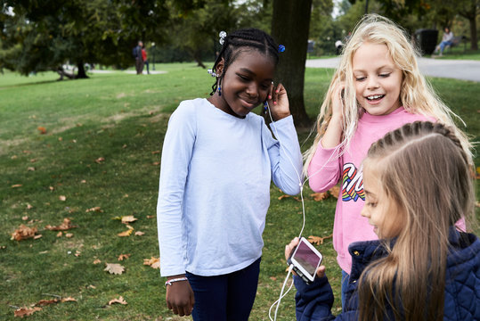 Kids sharing technology.
