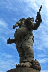 Ganesha, the largest in the world, 39 meters high. The hand holding lotus flowers, mangoes, bananas, sugar cane and jackfruit, and of mice hugging coconut. Chachoengsao, Thailand