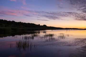 Spectacular colourful sunrise on the Léon-Provancher marsh during late summer, Neuville, Quebec, Canada