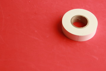 roll of white plastic insulating tape